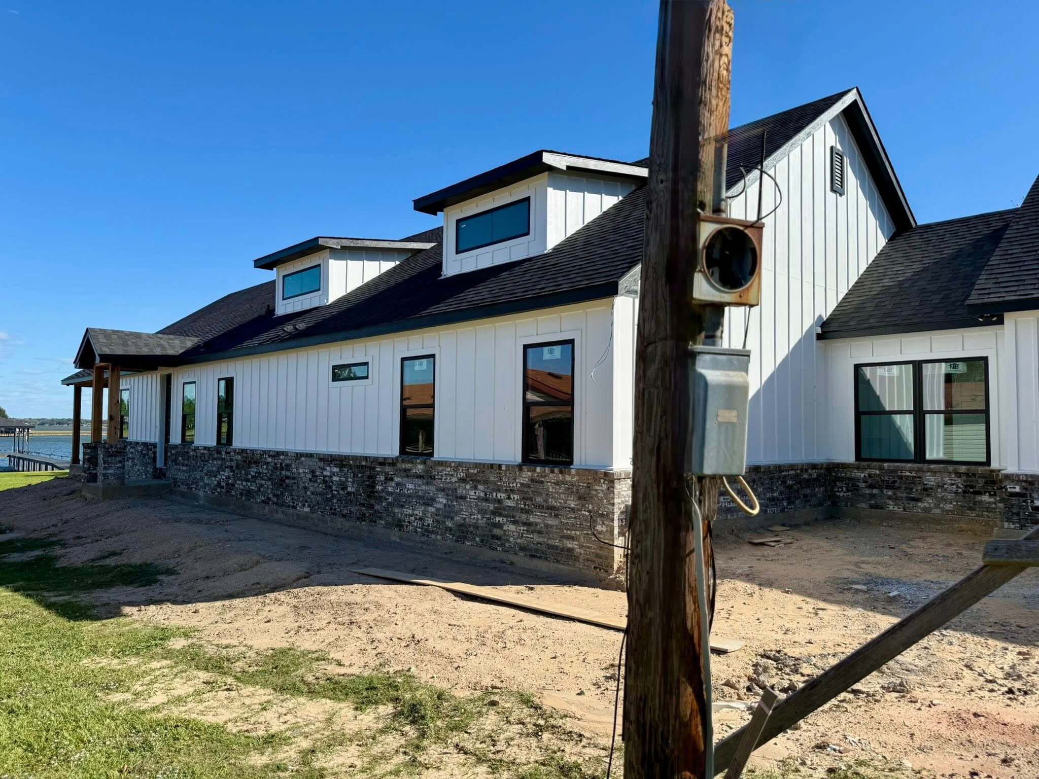 Custom modern farmhouse under construction by the lake in Seven Points, Henderson County, TX