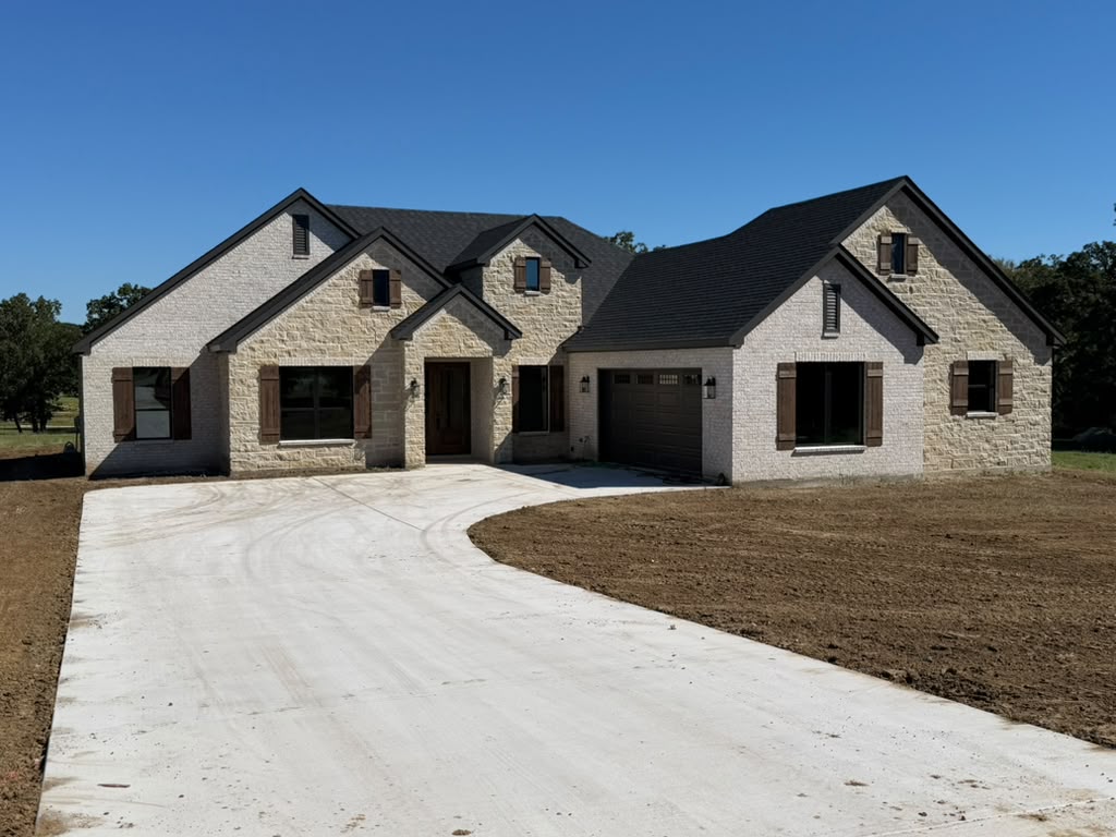 Custom stone home built on acreage in Canton TX by New Beginnings Custom Homes.